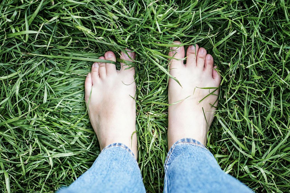 Grounding is the practice of connecting with the Earth’s electrical charge by walking barefoot on natural surfaces.