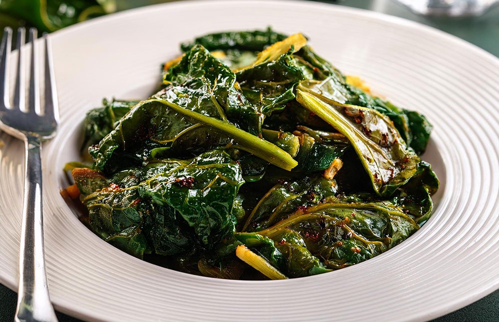 This version of collard greens maintains the savory flavor by swapping out the traditional ingredients.